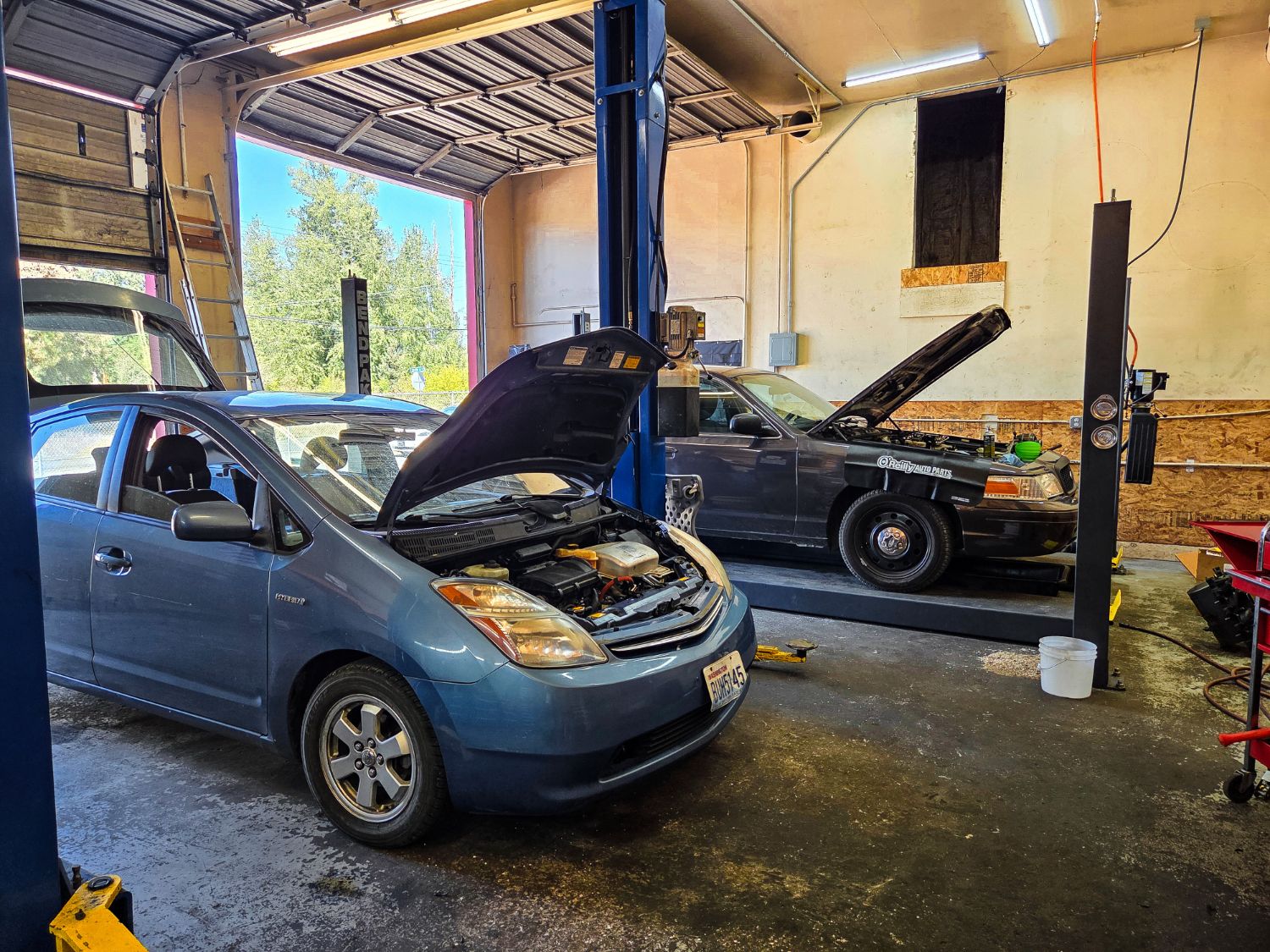 Two vehicles on the lifts in the Auto Star service bay in Graham, WA