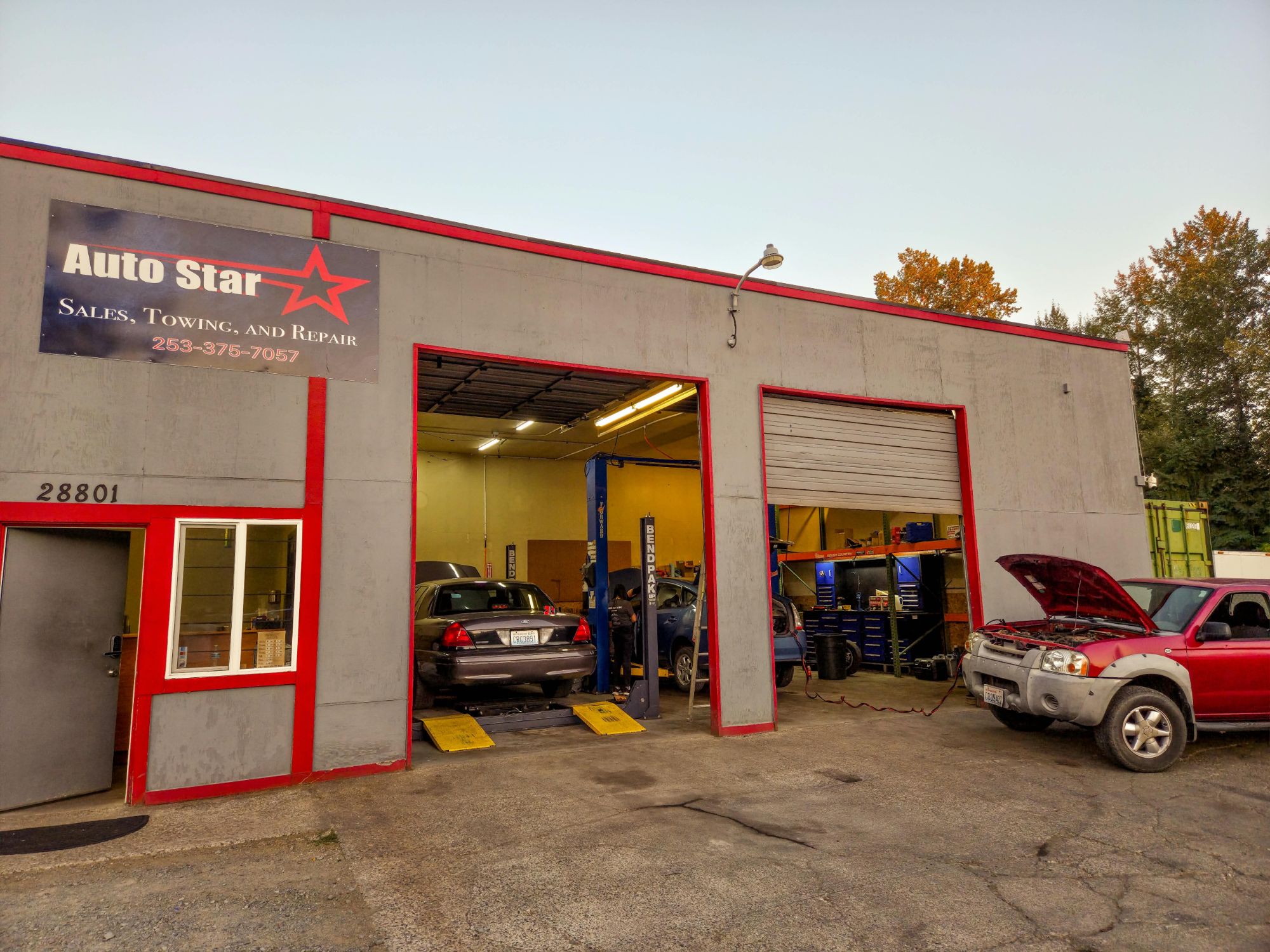 Auto Star shop with vehicles in the service bays