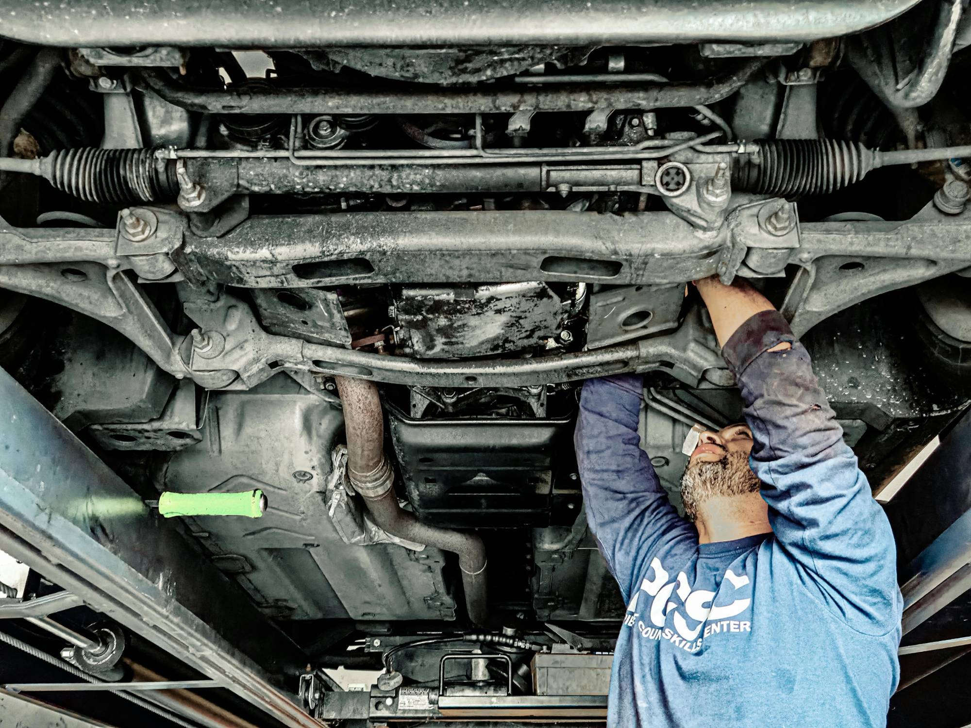 Steering and suspension work under a vehicle