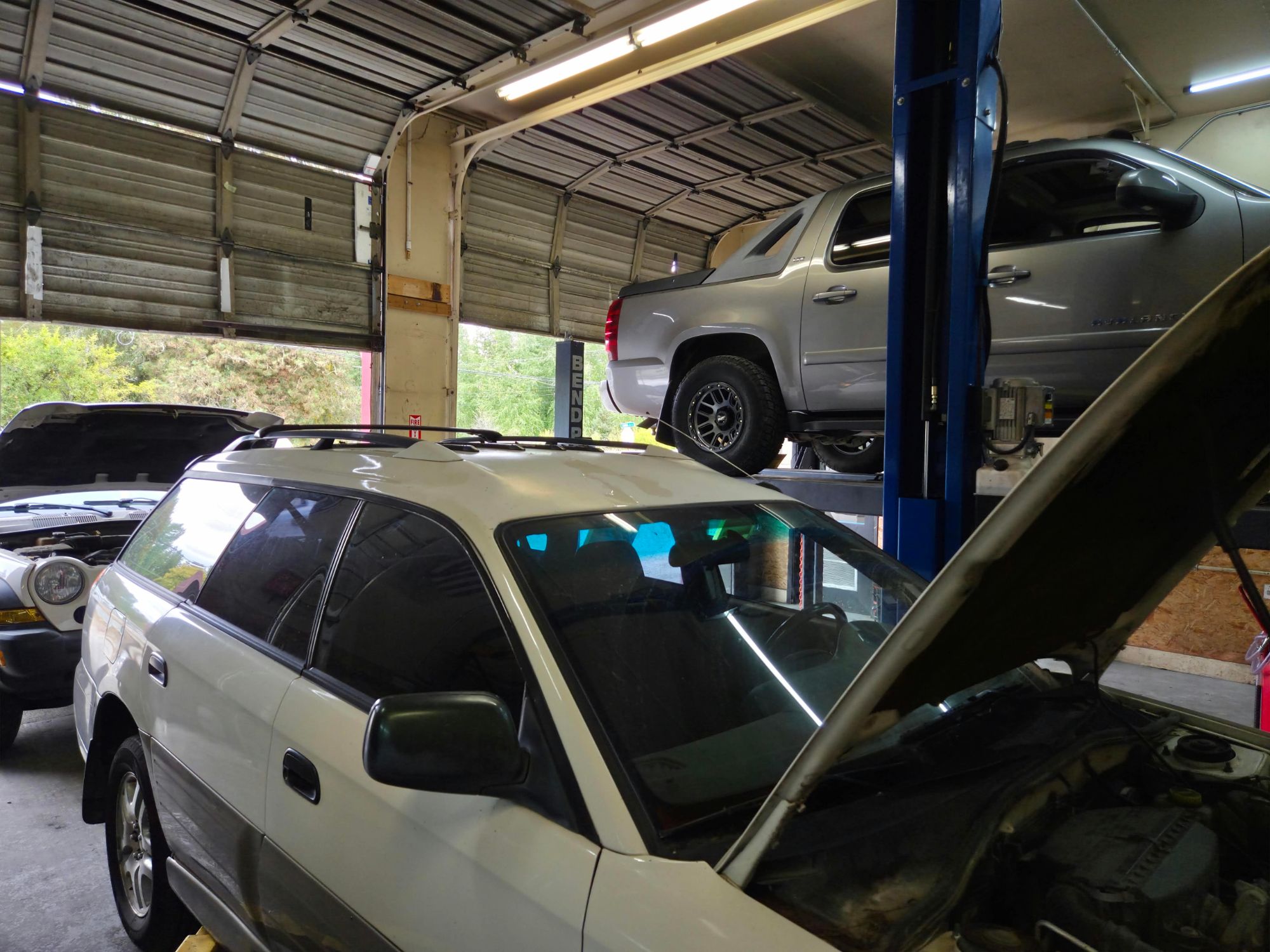 Multiple vehicles being serviced in the Auto Star bays