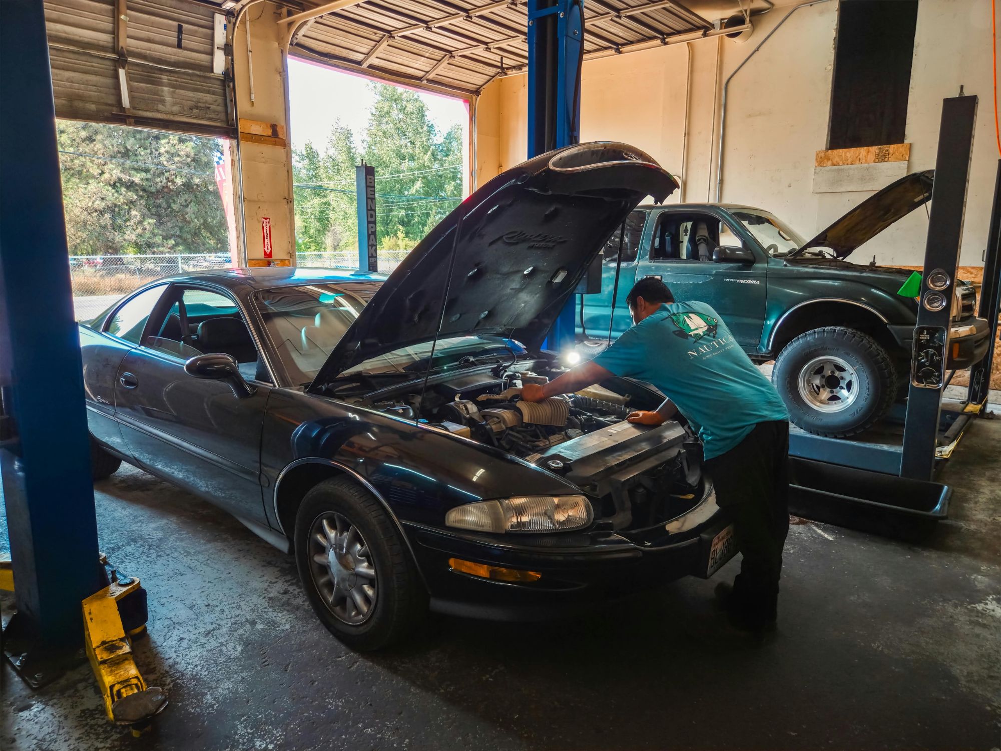 Technician working on an engine at Auto Star
