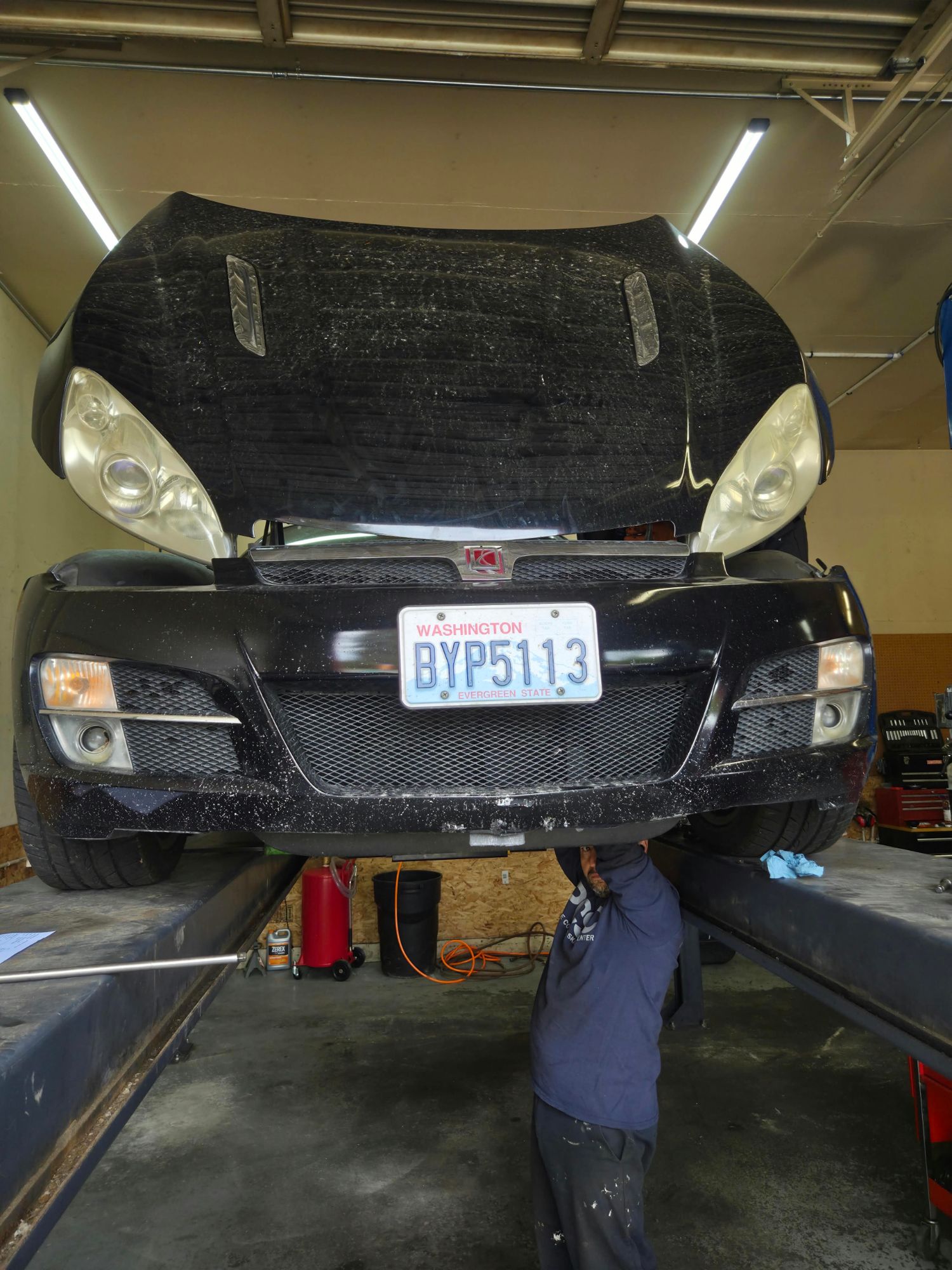 Vehicle raised for an underbody inspection